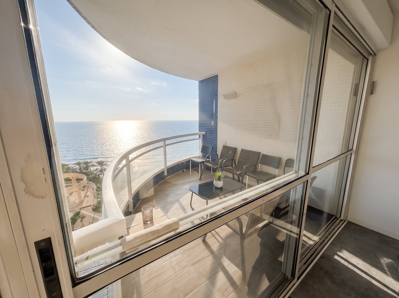 View over the Netanya coastline from the curved balcony of the Seafront Panorama apartment