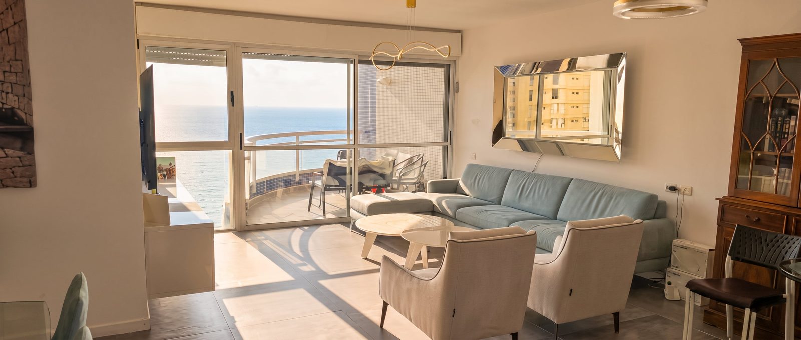Calm living room with two sofas at the Seafront Panorama apartment in Netanya